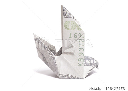 Origami Bird made of one hundred dollar banknote on white background 128427478
