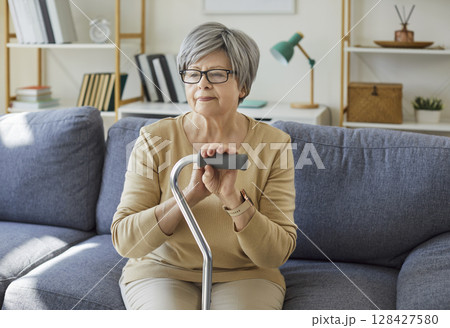 Senior old elder woman alone at home, lonely pensive pleasant grandmother, elderly person retired  128427580