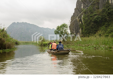 Group of tourists visiting the Van Long. Group of tourists visiting the Van Long. 128427663