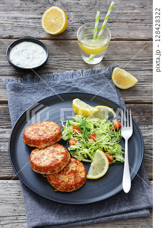 Hot Smoked salmon burgers, patties and coleslaw 128428322