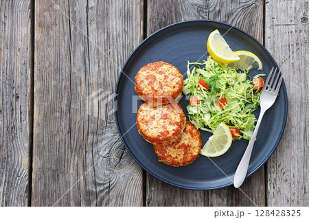 Hot Smoked salmon burgers, patties and coleslaw Hot Smoked salmon burgers, patties and coleslaw 128428325