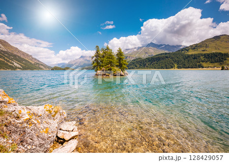 Great view on azure lake Silsersee (Sils) and peak Piz Corvatsch in the Swiss alps. Location Upper Engadine valley, Europe. 128429057