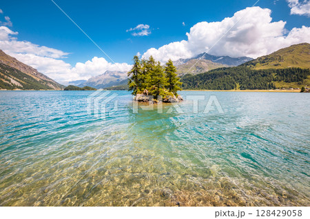 Great view on azure lake Silsersee (Sils) and peak Piz Corvatsch in the Swiss alps. Location Upper Engadine valley, Europe. 128429058