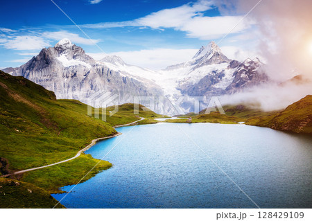 Panorama of Mt. Schreckhorn and Wetterhorn above Bachalpsee lake. Location Swiss alps, Bernese Oberland, Grindelwald, Europe Panorama of Mt. Schreckhorn and Wetterhorn above Bachalpsee lake. Location Swiss alps, Bernese Oberland, Grindelwald, Europe 128429109