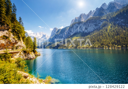 Alpine lake Vorderer Gosausee. Salzkammergut is a famous resort area located in the Gosau Valley in Upper Austria. Dachstein glacier. Alpine lake Vorderer Gosausee. Salzkammergut is a famous resort area located in the Gosau Valley in Upper Austria. Dachstein glacier. 128429122