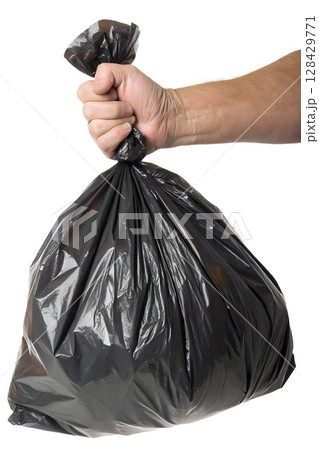Hand gripping full black garbage bag isolated on transparent background, waste management concept Hand gripping full black garbage bag isolated on transparent background, waste management concept 128429771