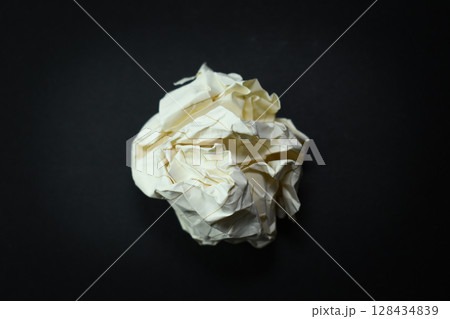 round lump paper on black background, recycle used paper 128434839