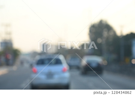 highway traffic with safety barrier on road asphalt, blurred image 128434862