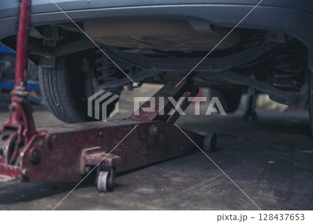 Mechanic tools engineering equipment car auto repair shop with copy space. Blurred background mechanical service. Heavy screw grungy rusted wrenches dirty screwdriver object. Industrial hardware set Mechanic tools engineering equipment car auto repair shop with copy space. Blurred background mechanical service. Heavy screw grungy rusted wrenches dirty screwdriver object. Industrial hardware set 128437653