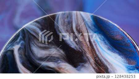 Flowing ink. Particles fluid. Defocused bronze blue purple color wet bubble shiny texture floating on abstract creative acrylic neon background. 128438253