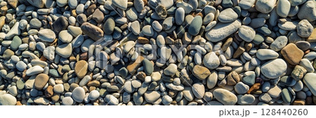 Smooth Beach Pebbles Background, Natural Texture, Seaside, Rocks, Stones. Panoramic View 128440260