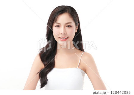 A beautiful young Asian woman with clean, fresh skin against a white background. Skincare, facial treatment, cosmetology, beauty, and spa. An elegant portrait of an Asian woman. 128442085