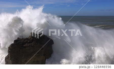 High waves breaking on the rocks of the coastline High waves breaking on the rocks of the coastline 128446556