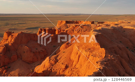 Bayanzag flaming cliffs at sunset in Mongolia 128446569