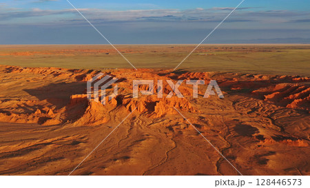Bayanzag flaming cliffs at sunset in Mongolia Bayanzag flaming cliffs at sunset in Mongolia 128446573