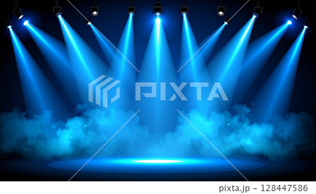 Bright concert stage lights illuminate a dynamic night music show with laser motion and colorful smoke 128447586