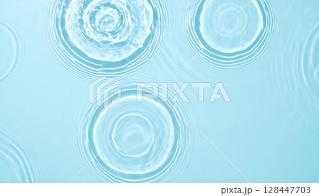 Aqua blue swimming pool water surface with abstract reflections and ripples Aqua blue swimming pool water surface with abstract reflections and ripples 128447703