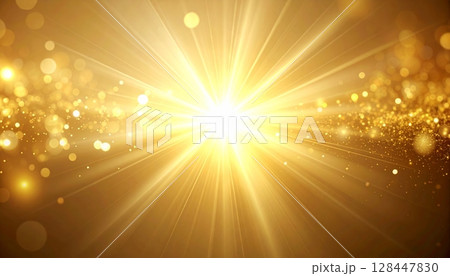 Golden sun rays burst brightly through the green summer grass, a glowing star in the sky 128447830