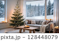 Cozy Christmas living room with decorated tree and candles in modern Scandinavian home interior 128448079