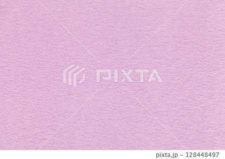 Texture of light lilac paper background with macro structure. Vintage pastel pink cardboard backdrop closeup 128448497