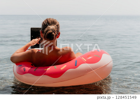 Woman Laptop Donut Float Ocean Beach Summer Work Remotely Woman Laptop Donut Float Ocean Beach Summer Work Remotely 128451549