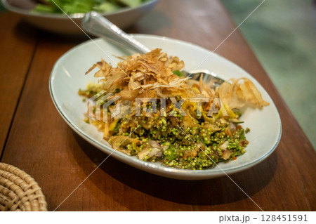 Traditional Thai Flower Salad with Banana Blossom and Herbs 128451591