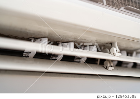 Mold on air conditioner close-up. Air conditioner maintenance and cleaning. Mold on air conditioner close-up. Air conditioner maintenance and cleaning. 128453388