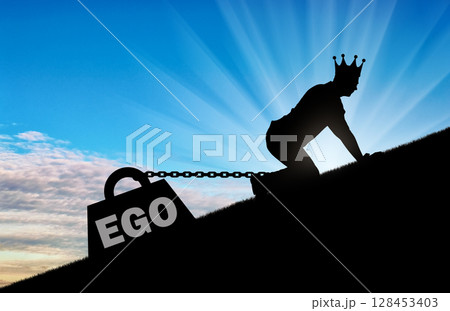 The silhouette of an egotistic man with a crown on his head creeps up. To his feet is bound the load - the ego The silhouette of an egotistic man with a crown on his head creeps up. To his feet is bound the load - the ego 128453403