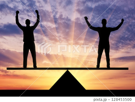 Silhouette two men are equal standing on the scales. 128453500