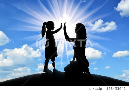 The child is a disabled girl with a prosthetic leg with her mother on the hill The child is a disabled girl with a prosthetic leg with her mother on the hill 128453641