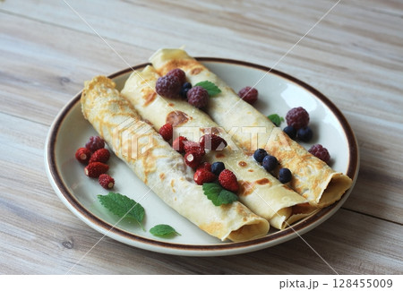 Plate of fresh pancakes. 128455009