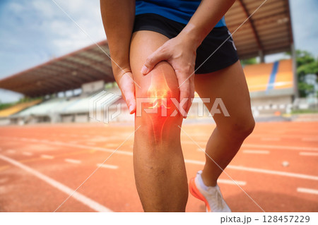 Knee Joint Pain in Runner on Track Knee Joint Pain in Runner on Track 128457229