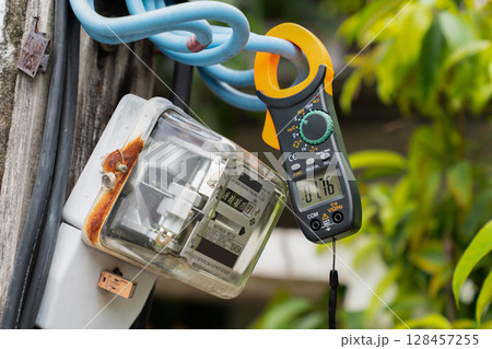 Outdoor Voltage Testing with Digital Clamp Meter Outdoor Voltage Testing with Digital Clamp Meter 128457255