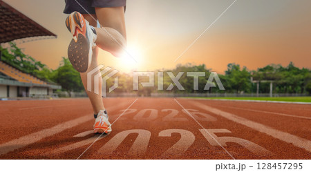 Athlete Sprinting on Track Towards New Year Goals 128457295