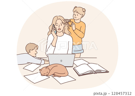 Mother works as freelancer at home and sits with children suffering from lack of workspace 128457312