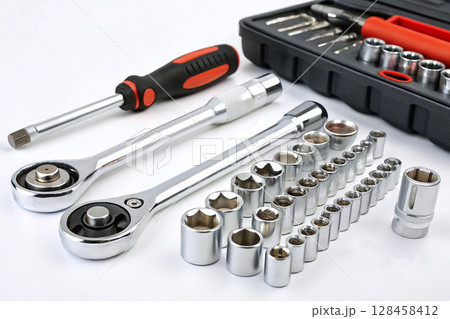 Socket wrench set with ratchets and accessories on white background. Socket wrench set with ratchets and accessories on white background. 128458412