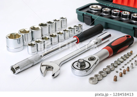 Socket wrench set with ratchets and accessories on white background. Socket wrench set with ratchets and accessories on white background. 128458413