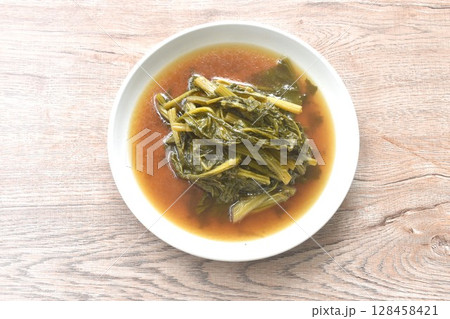 boiled spanich in sesame oil soup Chinese food on plate 128458421