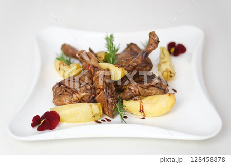 potatoes duck leg Chicken thighs grilled on hot barbecue charcoal flaming grill with sauce brushed on top. Juicy chicken meat roasted on bbq grill. slow motion 128458878