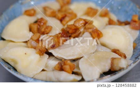 cook dumplings in a saucepan vareniki Step by step cooking process 128458882