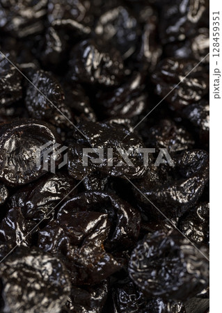 a large amount of prunes used in cooking, black prunes from small plums are dehydrated and pitted 128459351