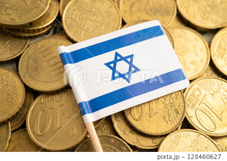 Israel flag on coin and banknote money, finance trading investment business currency. Israel flag on coin and banknote money, finance trading investment business currency. 128460627
