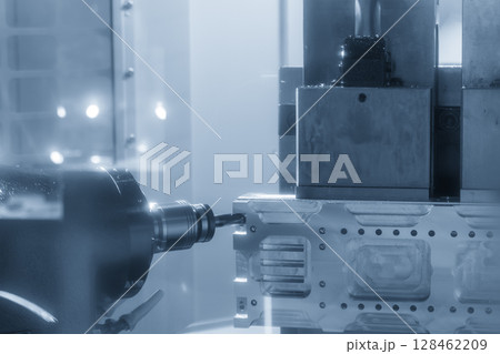 The horizontal CNC milling machine cutting the aluminum automotive parts by solid flat nose end mill tool in the light blue scene. 128462209
