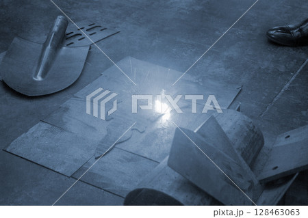 Laser cleaning of metal surfaces. Laser cleaning metal from rust. Glowing laser beam cleaning metal from rust. Laser removes removing old rust from metal. Innovation metalworking. New technologies 128463063