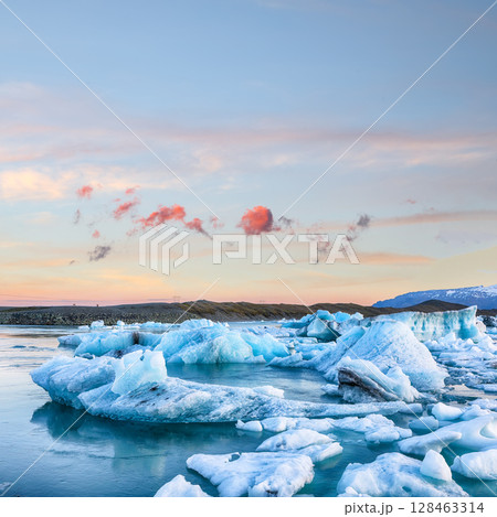 Ramarkable landscape with floating icebergs in Jokulsarlon glacier lagoon at sunset. Ramarkable landscape with floating icebergs in Jokulsarlon glacier lagoon at sunset. 128463314