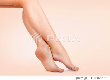 Beautiful female legs with smooth skin after depilation. Waxing concept Beautiful female legs with smooth skin after depilation. Waxing concept 128463542