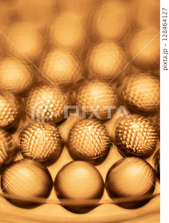 Close-up of shiny yellow vitamin capsules, healthy concept 128464127