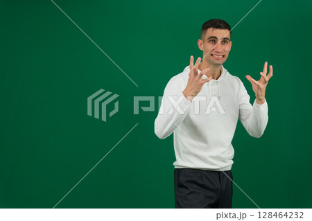 Stressed man sitting on sofa holding his head, feeling overwhelmed and anxious. Man experiencing mental health issues, worry, frustration, and emotional stress. Concept of anxiety and mental health 128464232