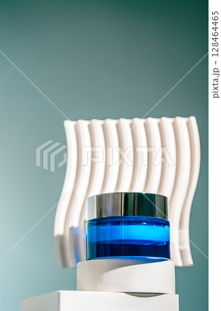 A blue glass jar of revitalizing face night cream A blue glass jar of revitalizing face night cream 128464465