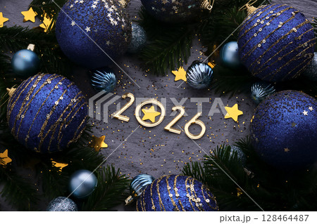 New Year 2026 blue background. Number of the coming year in Christmas decoration. New Year 2026 blue background. Number of the coming year in Christmas decoration. 128464487